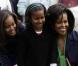 Malia, Sasha et leur mère Michelle Obama lors du lundi de Pâques à la Maison Blanche le 13 avril 2009