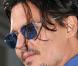 Johnny Depp, lors de l"avant-première hollywoodienne de "Public Enemies", au Mann"s Village Theatre de Westwood, à Los Angeles, le 23 juin 2009 !
