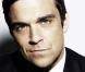 Robbie Williams : Nikos Aliagas l'aide à retrouver ses fans français !