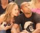 Thierry Henry et une amie lors du match de basket opposant les Etats-Unis à la France à New York le 15 août 2010