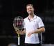 Michaël Llodra fête sa victoire contre Nikolai Davydenko en quart de finale du tournoi Paris-Bercy, en compagnie de son fils Téo, 3 ans, le 12novembre 2010