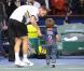 Michaël Llodra fête sa victoire contre Nikolai Davydenko en quart de finale du tournoi Paris-Bercy, en compagnie de son fils Téo, 3 ans, le 12novembre 2010