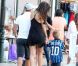 Wesley Sneijder se balade dans Saint-Tropez avec sa femme Yolanthe Cabau et son fils Jessey, avec le maillot de papa, le 25 juillet 2011