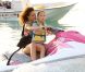 Rihanna fait du jet-ski avec une petite fille nommée Ali à la Barbade avec son petit frère le 29 décembre 2011