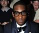 Le rappeur Tinie Tempah était sur son 31 au premier rang du défilé Lanvin automne-hiver 2012/2013 Paris, le 22 janvier 2012.