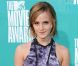 Emma Watson en robe Brood, bracelets Givenchy et Hermès et chaussures Tabitha Simmons lors des MTV Movie Awards 2012.