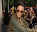 Rihanna, tout sourire en quittant son hôtel, s'apprête à atteindre la gare de King Cross San Pancras pour emprunter et l'Eurostar et rejoindre Paris. Le 1er septembre 2012.
