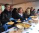 Antoine de Caunes et Anne-Sophie Lapix participent au service du curry géant cuisiné avec des légumes destinés à être jetés, pour dénoncer le gaspillage alimentaire, à Paris, le samedi 13 octobre 2012.