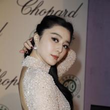 Fan BingBing scintille lors du photocall avant le déjeuner sur la terrasse Chopard à l'Hôtel Martinez lors du 66e festival de Cannes le 17 mai 2013.
