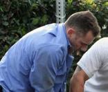 Les gardes du corps de David Beckham sur le photographe