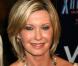 Olivia Newton-John sur la Grande Muraille de Chine pour récolter des fonds contre le cancer