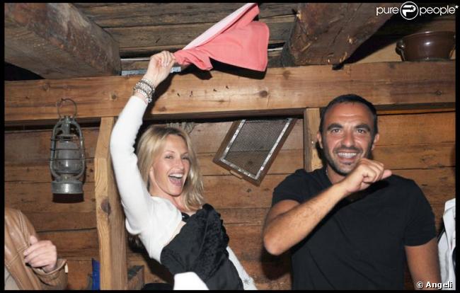 Estelle Lefébure et Nikos Aliagas lors de la soirée suivant le baptême de Joy à Gstaad le 5 juillet 2009