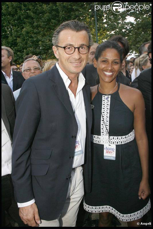François Sarkozy et une amie au concert de Johnny Hallyday sous la Tour Eiffel ! 14/07/09