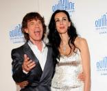 Mick Jagger et sa compagne L\'Wren Scott assistent à la projection du documentaire <i>Stones in Exile</i>, à Cannes, dans le cadre de la Quinzaine des Réalisateurs, mercredi 19 mai 2010.