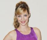 Louise Bourgoin, toute pimpante aux côtés de Luc Besson, à Berlin, le 5 août 2010.