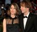Le jury de la 67e Mostra de Venise, présidé par Quentin Tarantino, a décerné à Sofia Coppola (photo : avec son compagnon Thomas Mars) le Lion d'Or pour le film Somewhere, porté par le duo d'acteurs Stephen Dorff-Elle Fanning.