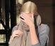 Charlize Theron à la sortie de l'Hôtel Ritz, où elle loge à l'occasion du tournage d'une pub pour Dior, à Paris, le 22 septembre 2010.