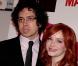 La ravissante Christina Hendricks et son compagnon Geoffrey Arend lors de la rencontre avec les fans de la série  Mad Men , au Forum des Images, à Paris, le 9 février 2011.