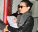 Miranda Kerr et Orlando Bloom à l'aéroport Roissy-Charles de Gaulle, à Paris, retournent à Los Angeles. 5 mars 2011