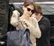 Katie Holmes et Tom Cruise en balade amoureuse. Elle exhibe un sac de sa création le 12 avril 2011 à New York