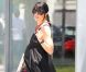 Selma Blair affiche ses rondeurs dans une robe longue noire. Vivement l'accouchement ! West Hollywood, 25 mai 2011