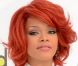 La chanteuse Rihanna a illuminé le tapis rouge des Billboard Music Awards dans un look masculin et blanc immaculé, contrastant avec sa coiffure rouge. Las Vegas, le 22 mai 2011. 