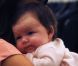 Victoria Beckham pouponne et choisit des robes avec sa fille Harper Seven dans les bras. New York, le 15 septembre 2011. 