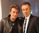 Johnny Hallyday et Michel Denisot sur le plateau du Grand Journal, le 9 décembre 2011.