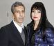 Le réalisateur Rachid Bouchareb et sa compagne ont assisté au défilé Dior Homme automne-hiver 2012/2013 à Paris, le 21 janvier 2012.