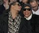 Le rappeur/acteur JoeyStarr était au premier rang du défilé Dior Homme à Paris, le 21 janvier 2012 avec une amie.