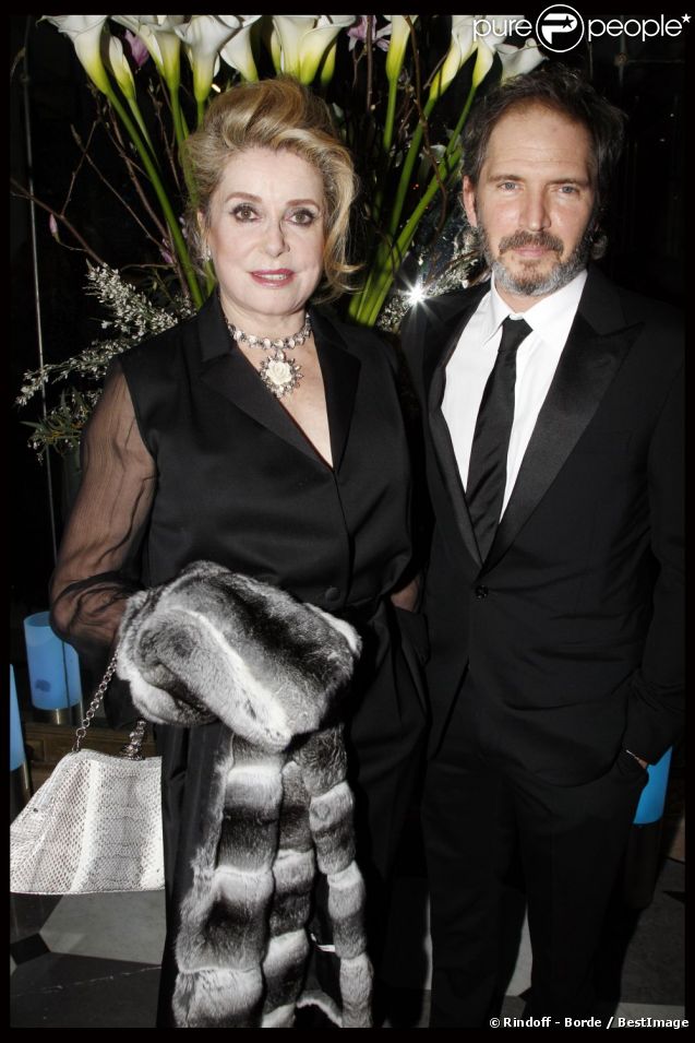 Catherine Deneuve et Christopher Thompson au 10e Dîner De La Mode à Paris, le 26 janvier 2012.