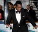 P. Diddy, élégant dans un smoking noir, fait le show devant les photographes présents devant le yacht de Denish Rich. Cannes, le 18 mai 2012.