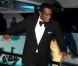P. Diddy, élégant dans un smoking noir, fait le show devant les photographes présents devant le yacht de Denish Rich. Cannes, le 18 mai 2012.