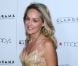 Sharon Stone, rayonnante le sourire aux lèvres, sur le tapis rouge du défilé Macy's Glamorama, le vendredi 7 septembre à Los Angeles.