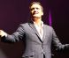 Dany Brillant sur la scène de l'Olympia durant le concert Leurs Voix pour l'Espoir. Paris, le 15 septembre 2012.
