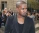 Kanye West tout en noir et chaussé d'Air Jordan 1, arrive à l'Hôtel National des Invalides pour assister au défilé prêt-à-porter Christian Dior printemps-été 2013. Paris, le 28 septembre 2012.