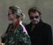 Johnny Hallyday et Laeticia à leur arrivée à l'aéroport de Paris Charles-de-Gaulle, le 9 octobre 2012.