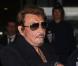 Johnny Hallyday et Laeticia à leur arrivée à l'aéroport de Paris Charles-de-Gaulle, le 9 octobre 2012.