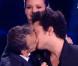 Elie Semoune embrasse Kev Adams, sous l'oeil de Marine Lorphelin, lors des NRJ Music Awards, à Cannes, le 26 janvier 2013.