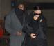 Kim Kardashian arrive incognito avec Kanye West à l'aéroport Roissy-Charles de Gaulle en provenance de Venise, habillée d'un long manteau noir et de bottes Givenchy. Le 10 janvier 2013.