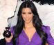 Kim Kardashian, entièrement habillée en Gucci collection printemps-été 2012, célèbre la sortie de son parfum éponyme à Londres. Juin 2011.
