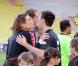  Charlotte Casiraghi embrasse son cousin Louis Ducruet - en arrière-plan, Novak Djokovic. 20e édition du match de football caritatif annuel World Stars Match, le 21 mai 2013, opposant la Star Team MC créée par le prince Albert de Monaco à une sélection de stars notamment de la F1, au Stade Louis II et au profit de la Fondation Princesse Charlene. 