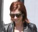 Kate Walsh est parfaite avec sa paire de bottines noires et sa mini taille haute ! 