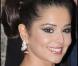 Cheryl Cole joue les divas avec un chignon orné d'une tresse.