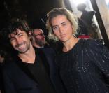 Vahina Giocante et un ami au défilé Stella McCartney le lundi 7 mars 2011 à Paris
