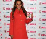 Mel B, le 14 mars 2011, à Berlin, masquait son ventre rond !