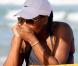 Serena Williams sur la plage à Miami, avec une amie, le 4 avril 2011