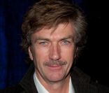 Philippe Caroit pose aux Globes de Cristal en février 2011 