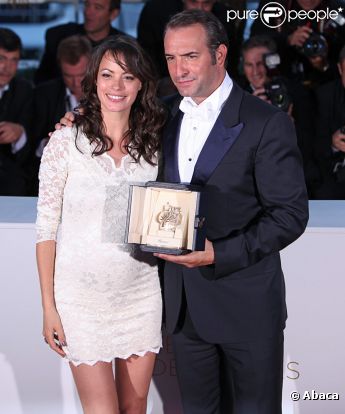 Jean Dujardin et Bérénice Bejo lors de la séance photo post-palmarès du festival de Cannes le 22 mai 2011
