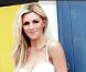 Abbey Clancy, maman depuis mars 2011 et prête à épouser Peter Crouch le 30 juin, a retrouvé sa silhouette adulée de mannequin lingerie pour promouvoir la marque d'auto-bronzants St. Tropez.